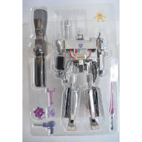 157 - Two large Takara Tomy Transformers Masterpiece models (both gun mode) to include MP-5 Destron Leader... 