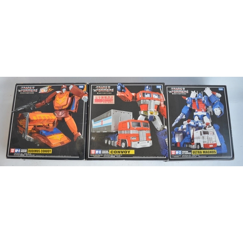 158 - Three large Takara Tomy Transformers Masterpiece models to include MP-9 Cybertron Protector 'Rodimus... 