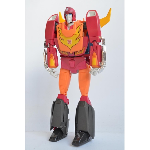 158 - Three large Takara Tomy Transformers Masterpiece models to include MP-9 Cybertron Protector 'Rodimus... 