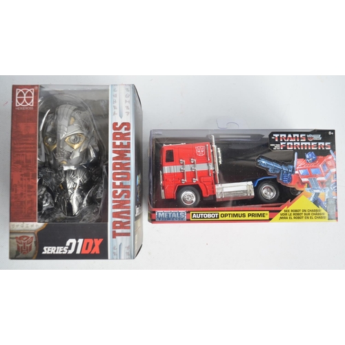 173 - Seven boxed Transformer models from Hasbro to include vintage Optimus Prime (item no E 5796, box uno... 