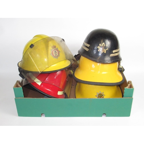 1286 - Five British vintage firefighter helmets of various styles and eras, including c1960s Warrington hel... 