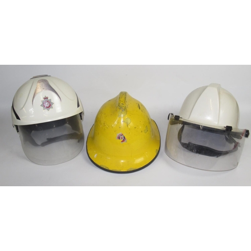 1288 - Five British vintage firefighter helmets of various styles and eras, including a c1990 Cromwell 'Fir... 