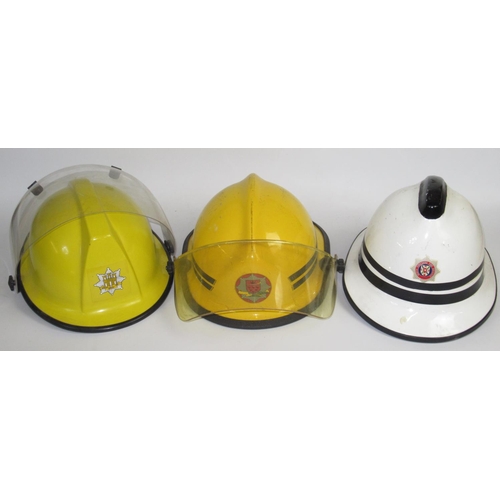 1289 - Five British vintage firefighter helmets of various styles and eras, including a c1993 Bullard PH210... 