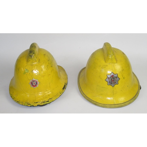 1289 - Five British vintage firefighter helmets of various styles and eras, including a c1993 Bullard PH210... 