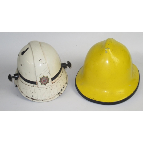 1291 - Five British vintage firefighter helmets of various styles and eras, including a c1993 Cumbrian Crom... 