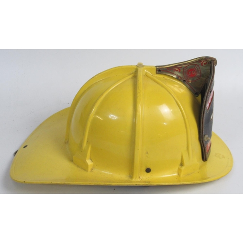 1297 - C1980s Cairns and Bro helmet, with original lining and 'Southfield Fire Department' shield