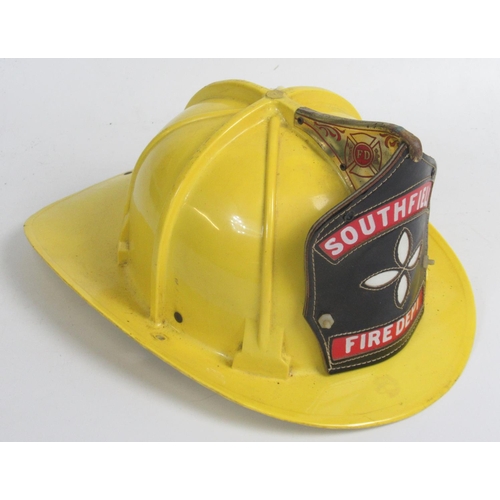 1297 - C1980s Cairns and Bro helmet, with original lining and 'Southfield Fire Department' shield