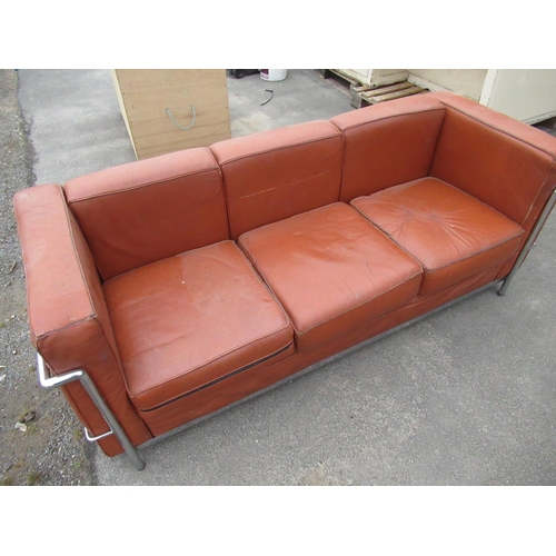 597 - Le Corbusier style chrome framed brown leather sofa with loose back and seat cushions, W175cm D72cm ... 