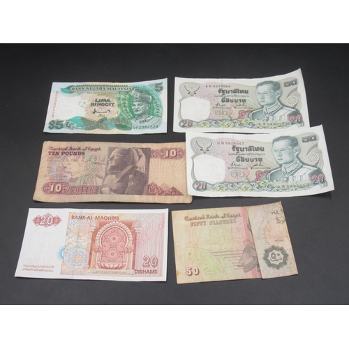 580 - Assorted collection of International coins and bank notes to inc. dollars, dirhams piastres, etc.