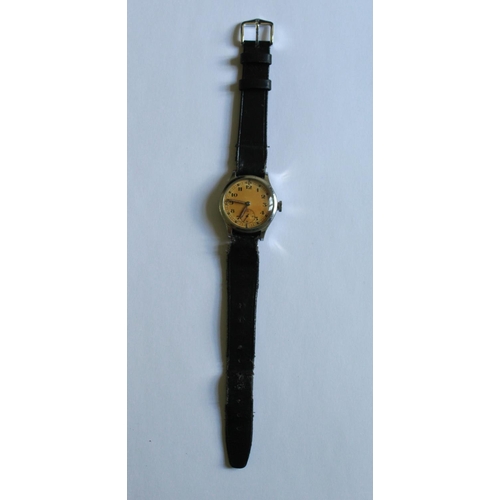 1253 - Revue 57 (Vortex) Military wrist watch. Steel case and back. Gold coloured face with subsidiary seco... 