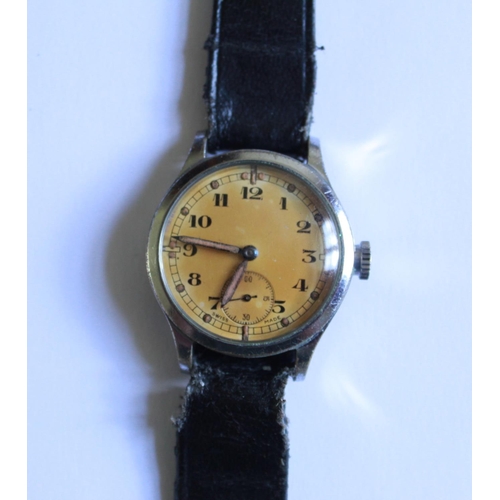 1253 - Revue 57 (Vortex) Military wrist watch. Steel case and back. Gold coloured face with subsidiary seco... 