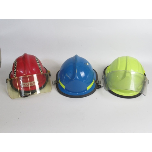 1304 - Three vintage American Fireman helmets, including a c1987 Bullard Poss USAF helmet, a c1990s Cairns ... 