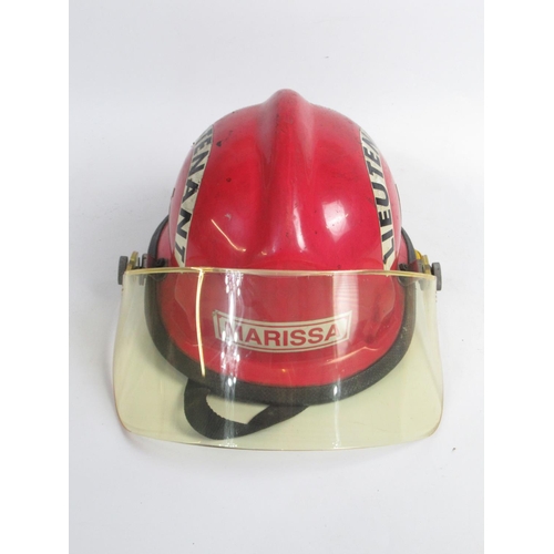 1304 - Three vintage American Fireman helmets, including a c1987 Bullard Poss USAF helmet, a c1990s Cairns ... 