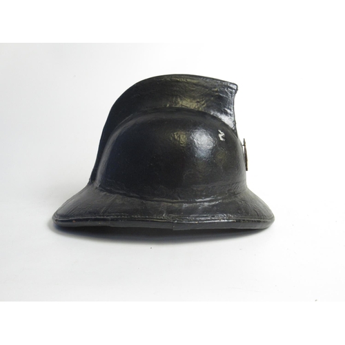 1311 - C1940s Levoir Cork helmet with original lining and a WWII Belgian Civil Defence Force badge