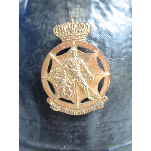 1311 - C1940s Levoir Cork helmet with original lining and a WWII Belgian Civil Defence Force badge