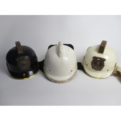 1312 - Two C1950s Dutch brass and plastic Fireman helmets, including one from Haarlem, and a C1980s Dutch p... 