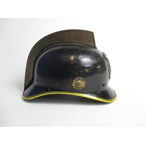 1312 - Two C1950s Dutch brass and plastic Fireman helmets, including one from Haarlem, and a C1980s Dutch p... 