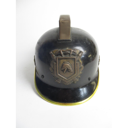 1312 - Two C1950s Dutch brass and plastic Fireman helmets, including one from Haarlem, and a C1980s Dutch p... 