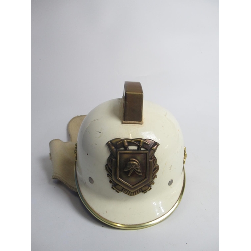 1312 - Two C1950s Dutch brass and plastic Fireman helmets, including one from Haarlem, and a C1980s Dutch p... 