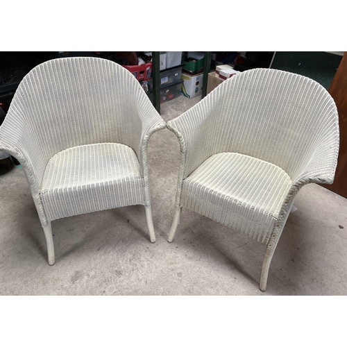 609 - Pair of cream painted Lloyd Loom type conservatory arm chairs, (2)