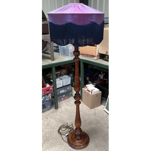 610 - Edwardian style turned wooden standard lamp, on circular base with fringed shade, H166 max