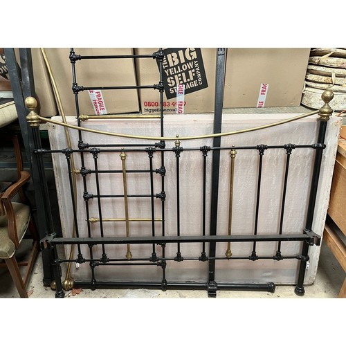 602 - Victorian style brass and cast metal double bed with side rails ands folding base, W150cm H136cm