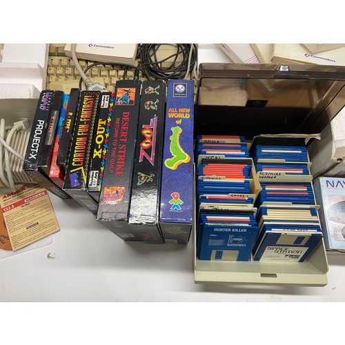 1054 - Two boxed Commodore Amiga computer systems including model 500 and 600, two navigator controllers, l... 