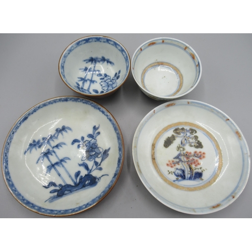 1049 - Two Nanking cargo porcelain tea bowls and saucers, both with tree and floral decoration, cup D7.5cm