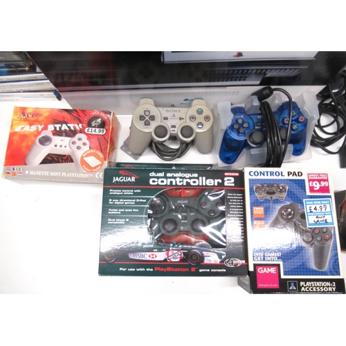 1050 - Boxed Playstation 3 games console with four controllers incl, Jaguar racing controller, ten PS3 game... 