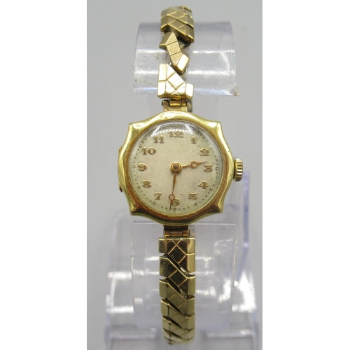 503 - Ladies Swiss 18ct gold wristwatch on gold plated expanding bracelet, silvered dial, pressed gilt Ara... 