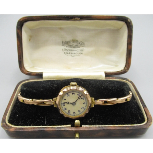 504 - Ladies Rolls 9ct gold wristwatch on Britannic 9ct rolled gold expanding bracelet retailed by Richard... 