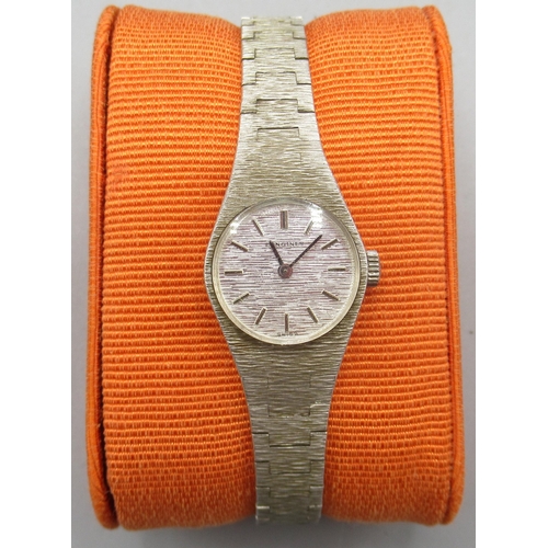 505 - 1970's ladies Longines silver wristwatch on integrated bark effect bracelet, signed textured dial, a...