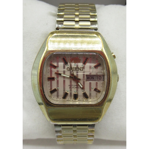 518 - Orient gold plated automatic wristwatch with quick set day date, signed striped dial, applied baton ... 