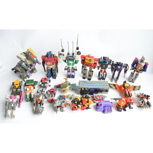 243 - Large collection of previously used Transformers action figures and models, accessories, manuals, em... 