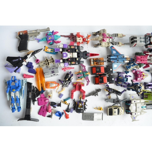 243 - Large collection of previously used Transformers action figures and models, accessories, manuals, em... 