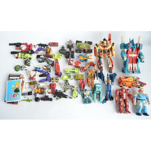 243 - Large collection of previously used Transformers action figures and models, accessories, manuals, em... 