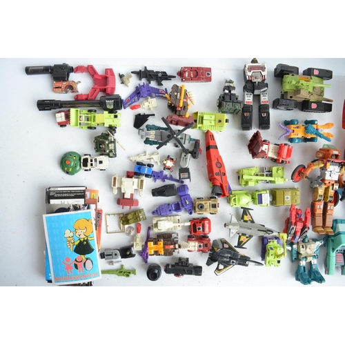 243 - Large collection of previously used Transformers action figures and models, accessories, manuals, em... 