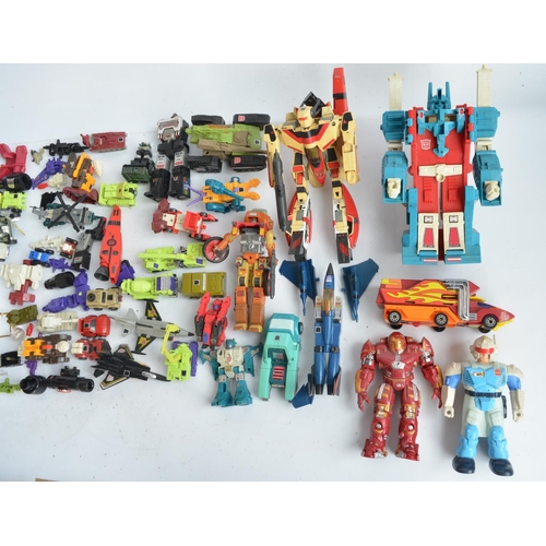 243 - Large collection of previously used Transformers action figures and models, accessories, manuals, em... 