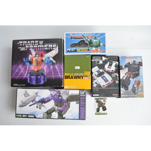 243 - Large collection of previously used Transformers action figures and models, accessories, manuals, em... 