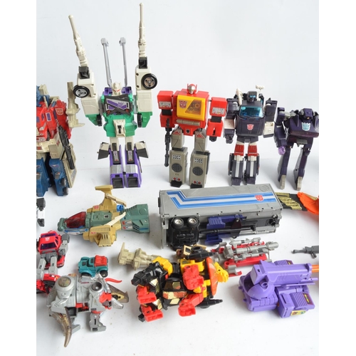 243 - Large collection of previously used Transformers action figures and models, accessories, manuals, em... 