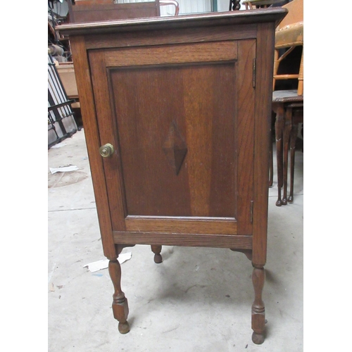 620 - Old Charm oak bookcase with two linenfold panel doors, W93cm D33cm H155cm and an oak bedside cabinet... 