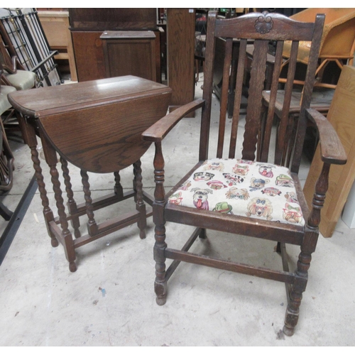 621 - 20th century oak elbow chair and a small oval gateleg table on barley-twist supports (2)