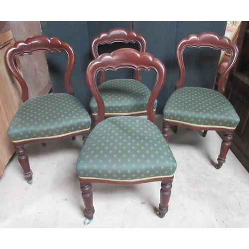 625 - Set of four Victorian mahogany balloon back dining chairs, on turned supports with casters (4)