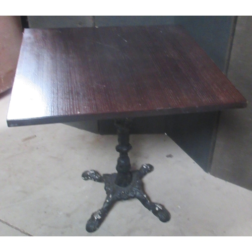 629 - Cafe table, square wooden top on cast metal base with four paw feet, W70cm D70cm H72cm