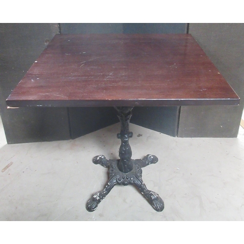 629 - Cafe table, square wooden top on cast metal base with four paw feet, W70cm D70cm H72cm