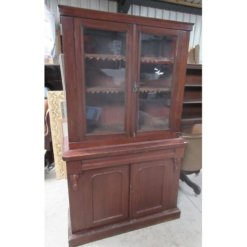 722 - Victorian mahogany bookcase, two glazed above two panel doors on skirted base, W107cm D43cm H185cm