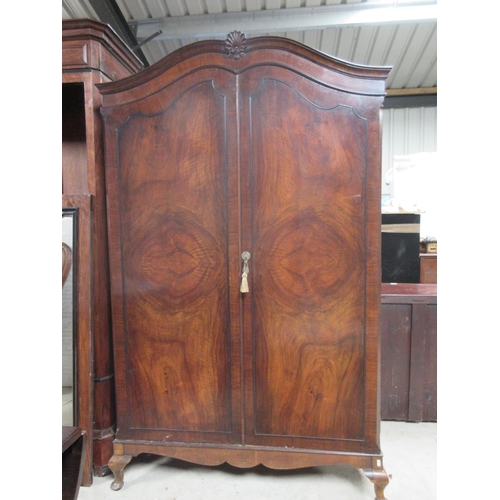 724 - 20th century figured walnut wardrobe, arched top with two doors on cabriole legs, W125cm D75cm H197c... 