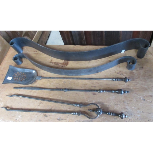 751 - Two cast iron serpentine fire fenders and three polished steel fire tools, W93cm max (5)