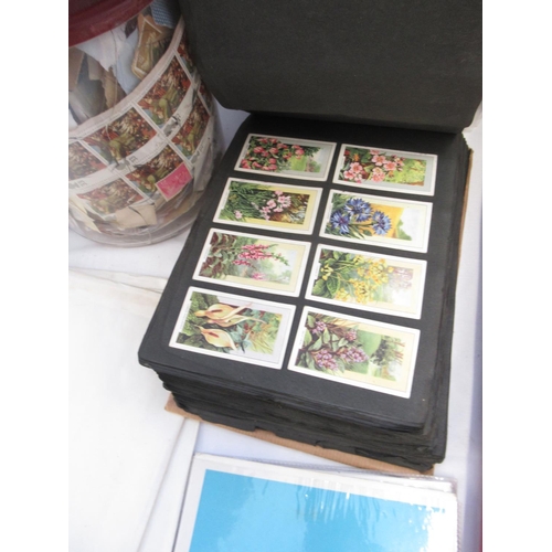 640 - Mixed collection of GB and International stamps, FDCs and cigarette cards, loose and in albums