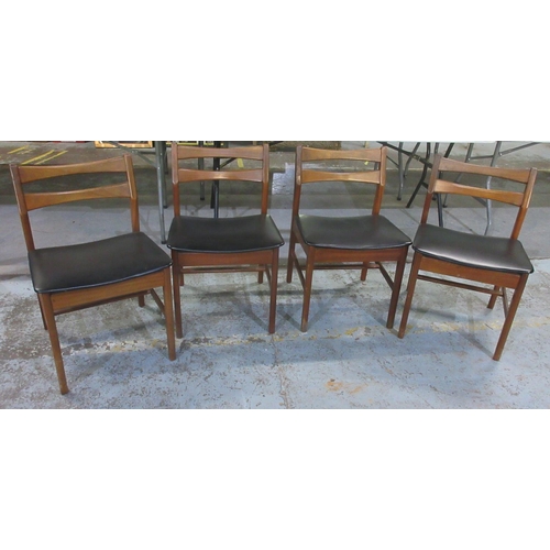 632 - Set of four mid-century teak dining chairs, black upholstered seats on tapered supports, (4)